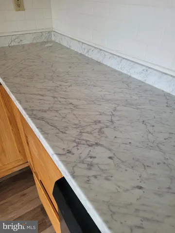 a white refrigerator freezer sitting in a kitchen
