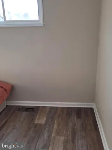 a bedroom with a bed and cabinets