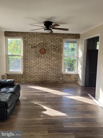 a front view of houses with yard