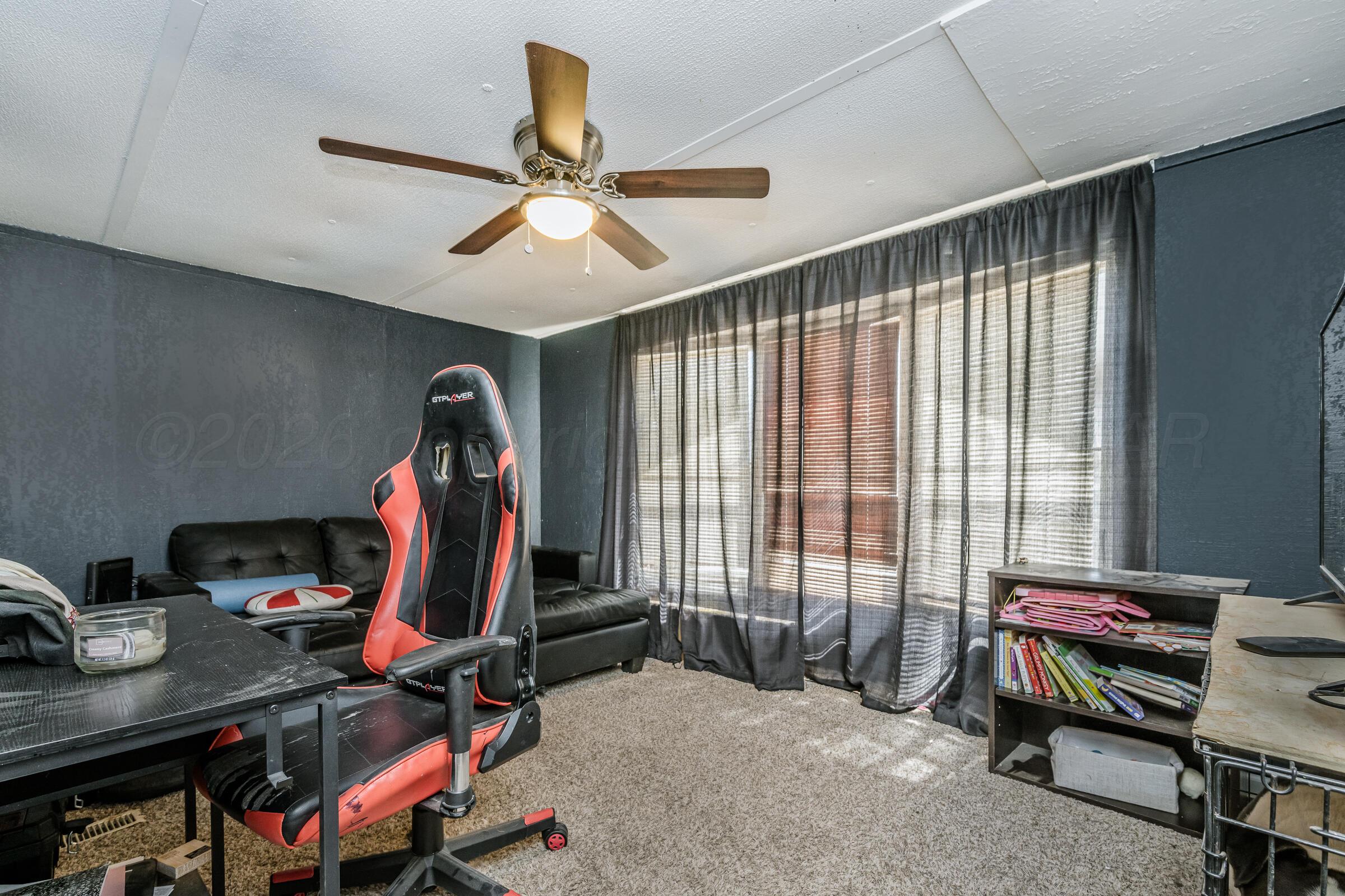 2115 Country Lane Amarillo, TX 79118 - Photo 15 of 15 a view of a workspace with furniture and a window