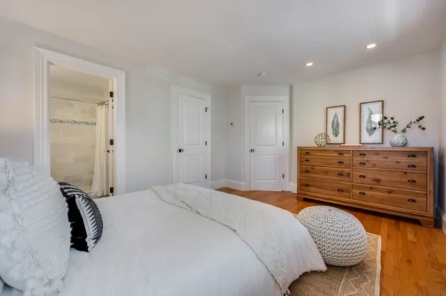 a bedroom with a bed and a dresser