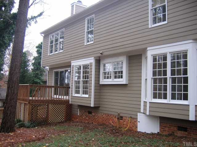 1421 Bridgeport Drive Raleigh, NC 27615 - Photo 8 of 10 a view of a house with a window and wooden fence