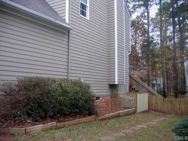 1421 Bridgeport Drive Raleigh, NC 27615 - Photo 9 of 10 a view of a house with a yard