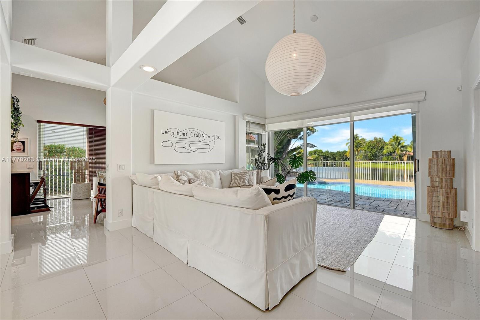 1055 San Luis Rey Weston, FL 33326 - Photo 11 of 75 a living room with furniture and a large window