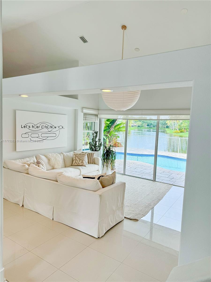 1055 San Luis Rey Weston, FL 33326 - Photo 13 of 75 a living room with furniture and a large window