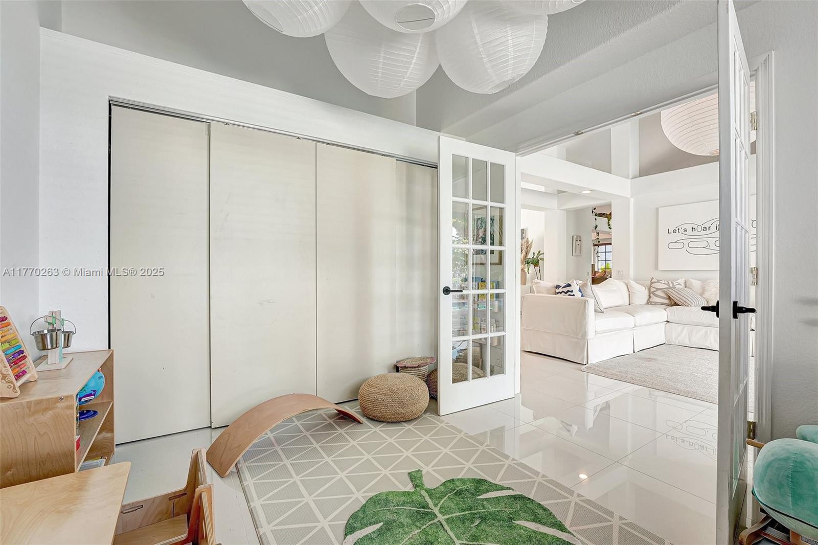 1055 San Luis Rey Weston, FL 33326 - Photo 16 of 75 a bedroom with a bed a table and chair