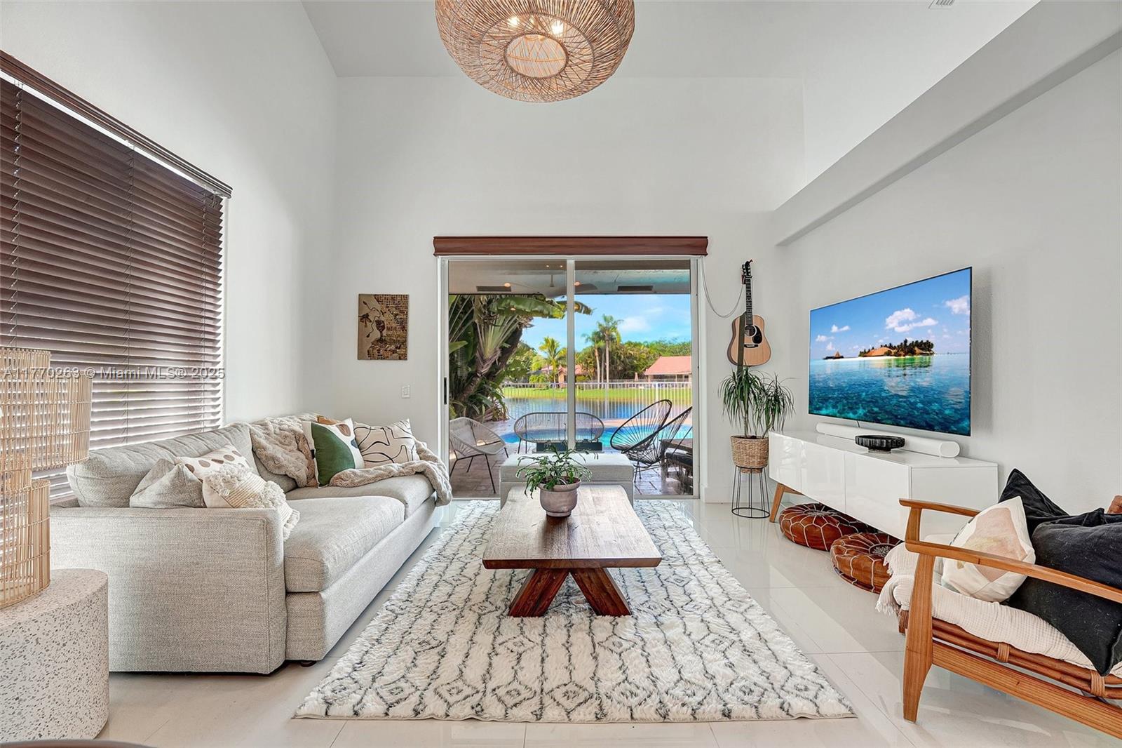 1055 San Luis Rey Weston, FL 33326 - Photo 18 of 75 a living room with furniture and a flat screen tv