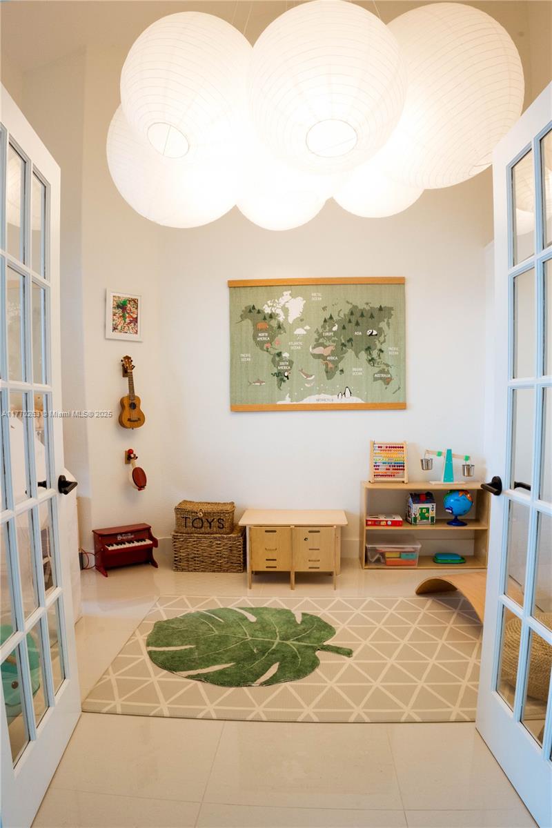 1055 San Luis Rey Weston, FL 33326 - Photo 44 of 75 a living room with furniture and a painting on the wall