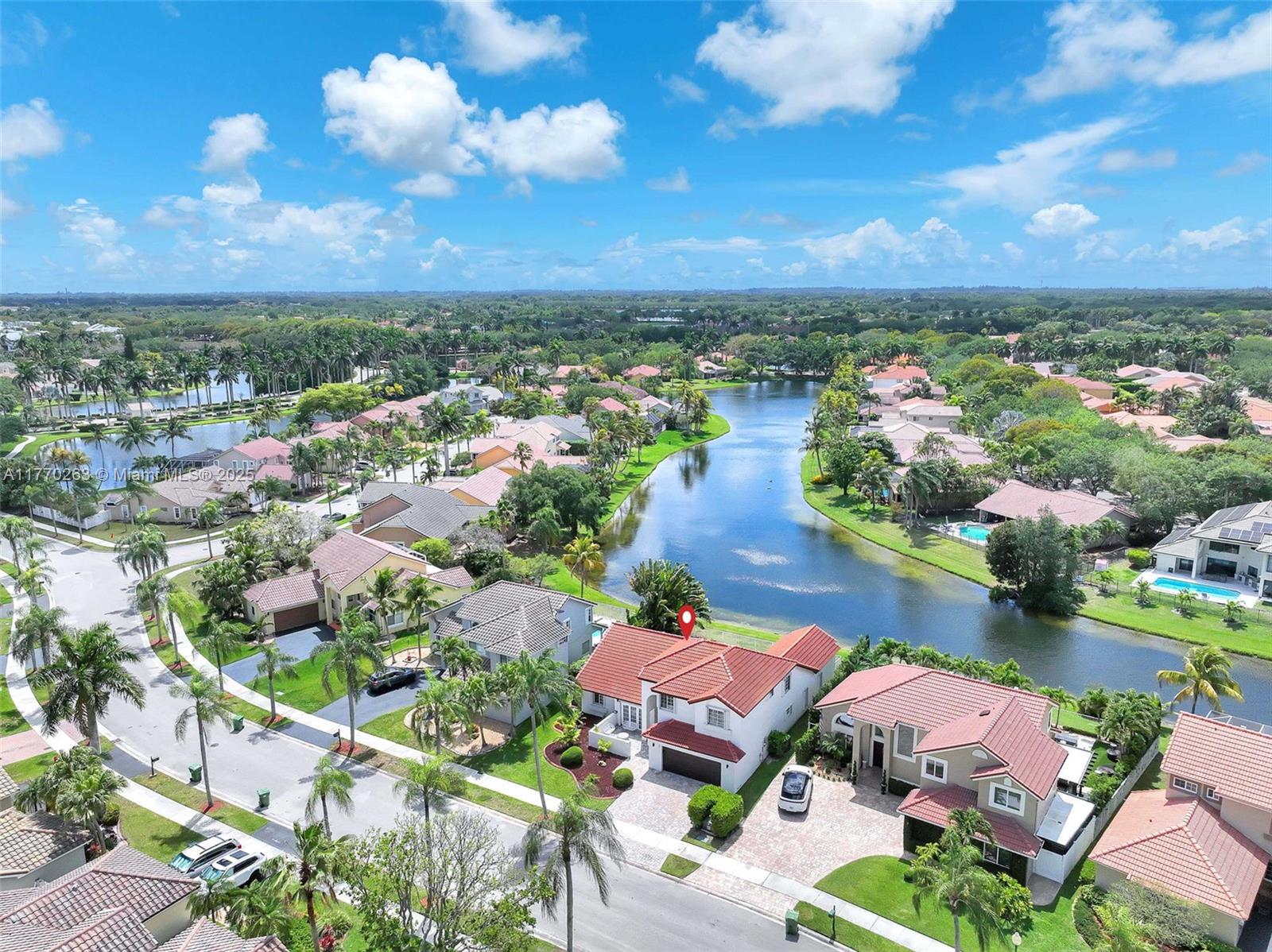 1055 San Luis Rey Weston, FL 33326 - Photo 56 of 75 an aerial view of lake residential houses with outdoor space and seating