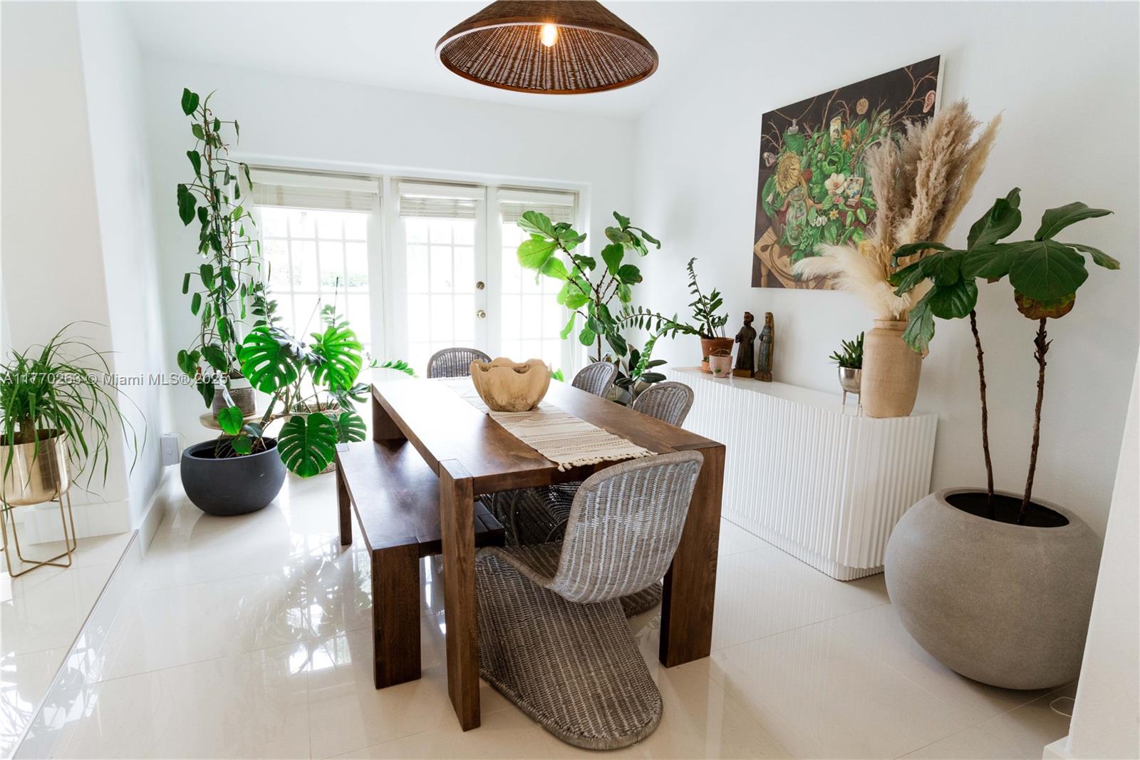 1055 San Luis Rey Weston, FL 33326 - Photo 6 of 75 a dining room with furniture and potted plant
