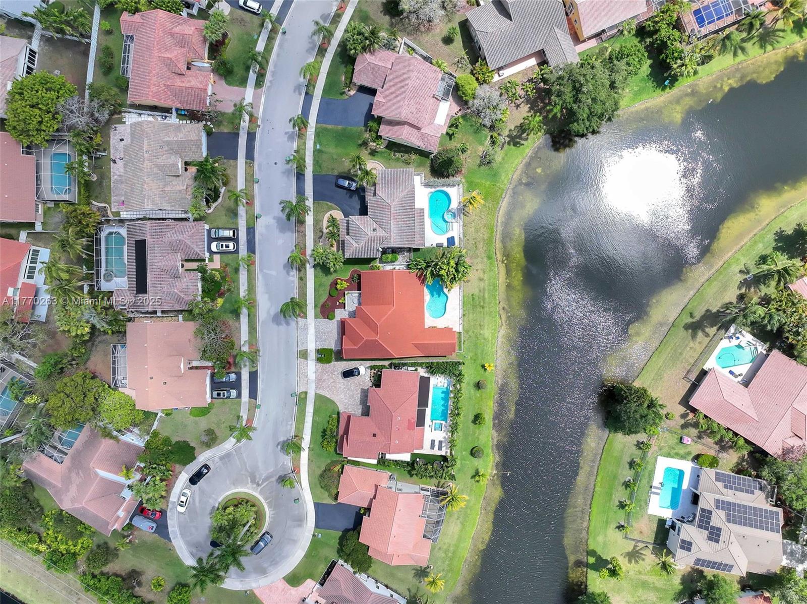 1055 San Luis Rey Weston, FL 33326 - Photo 61 of 75 an aerial view of residential house with outdoor space and swimming pool