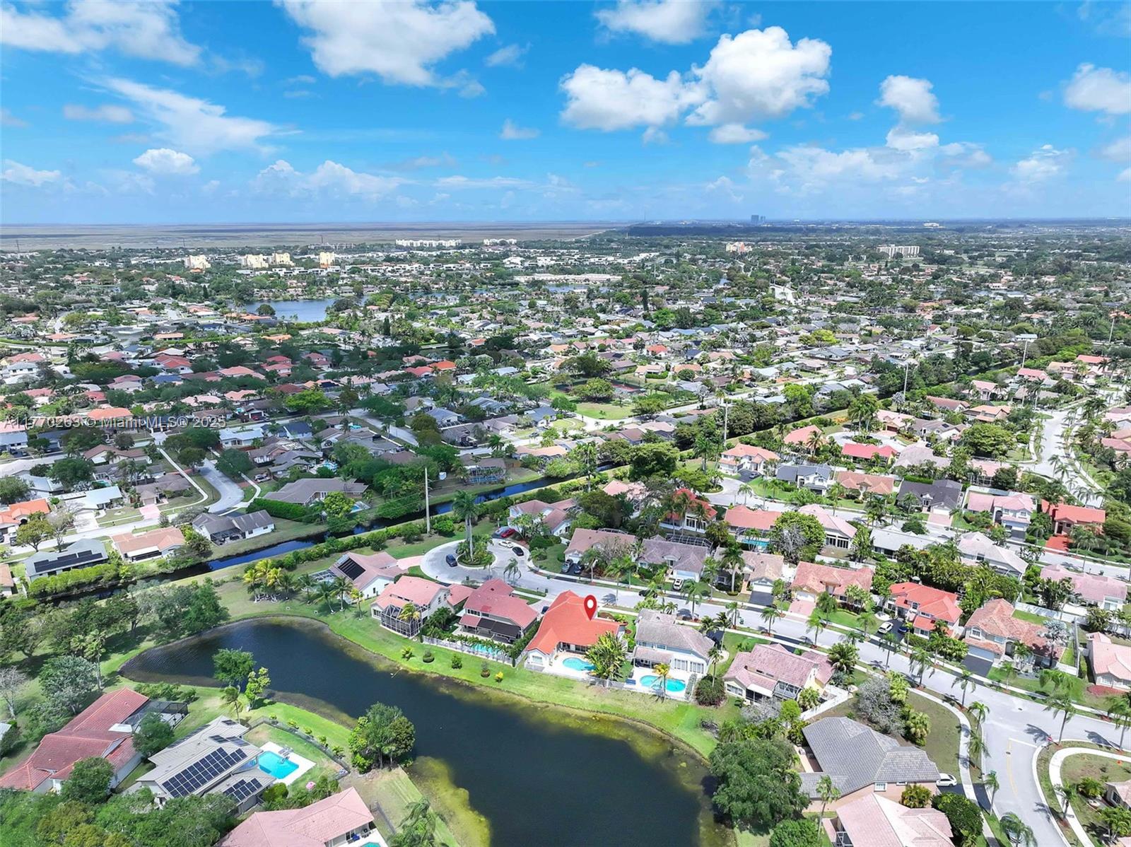 1055 San Luis Rey Weston, FL 33326 - Photo 68 of 75 an aerial view of residential houses with outdoor space and trees