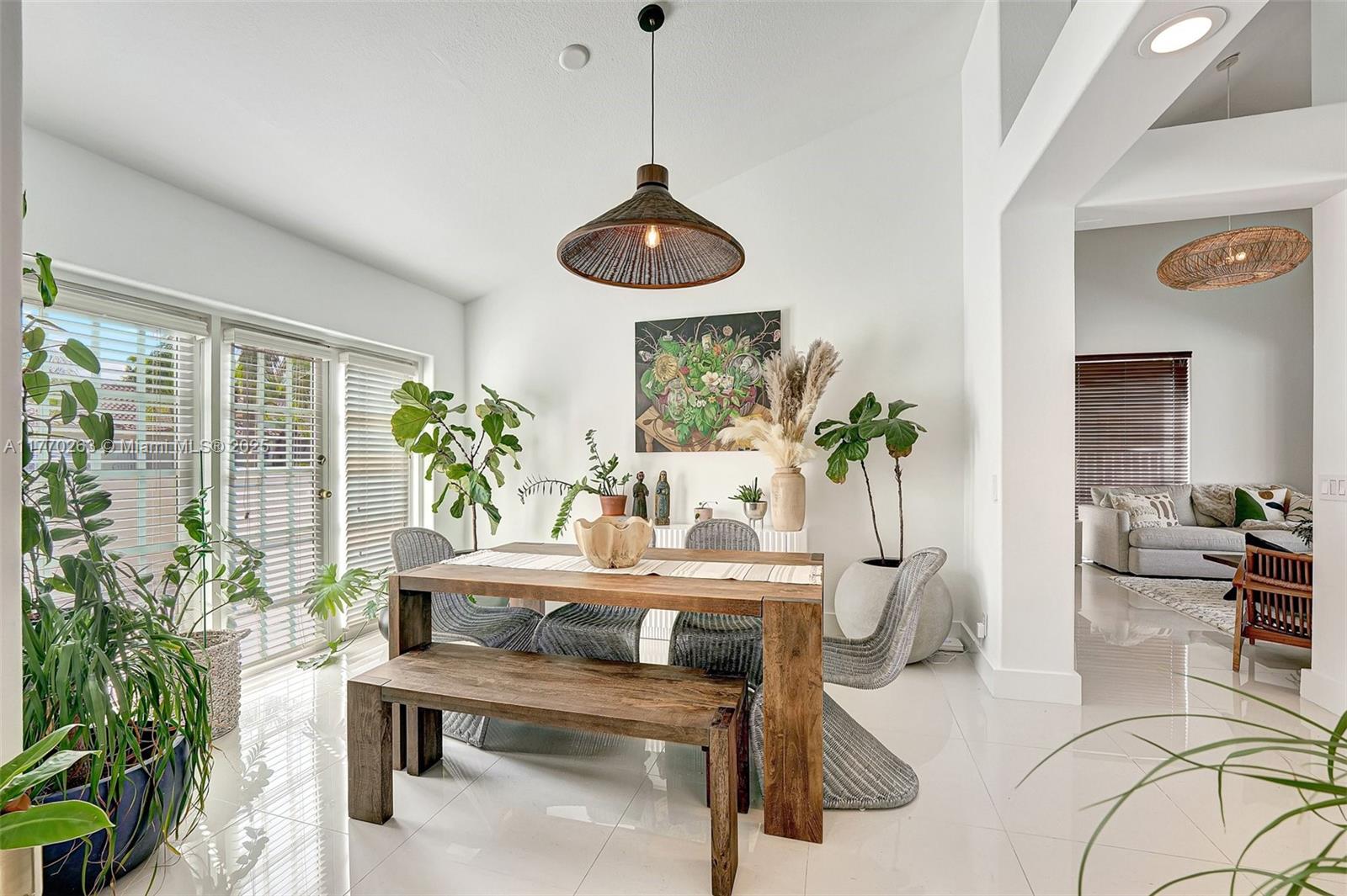 1055 San Luis Rey Weston, FL 33326 - Photo 8 of 75 a living room with furniture and a potted plant