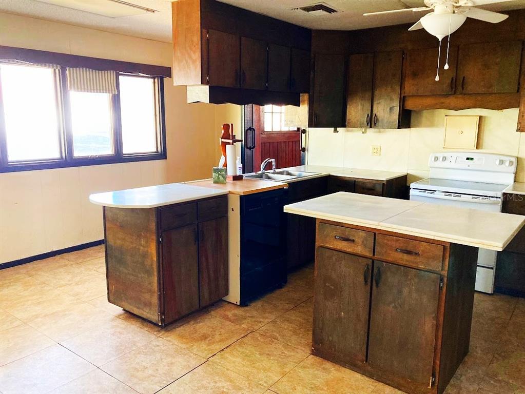 125 Southwest 6th Street Lake Butler, FL 32054 - Photo 16 of 23 a kitchen with a sink cabinets and window