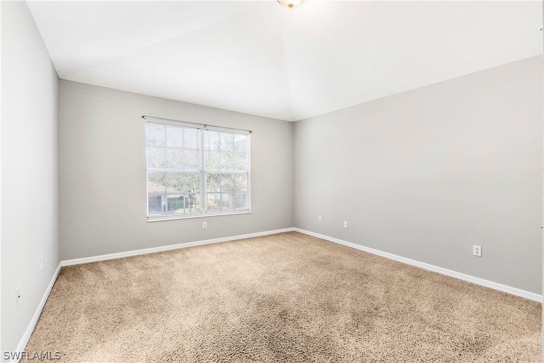 15633 Marcello Circle, Unit 133 Naples, FL 34110 - Photo 11 of 23 an empty room with windows