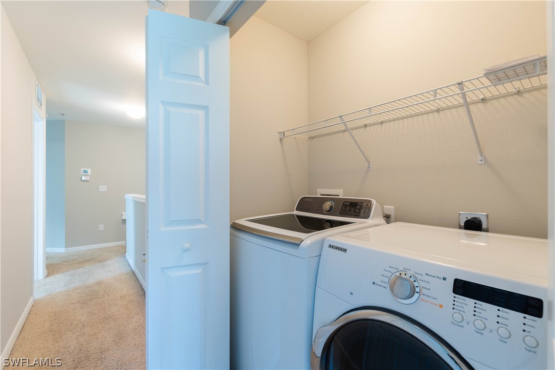 15633 Marcello Circle, Unit 133 Naples, FL 34110 - Photo 18 of 23 a utility room with dryer and washer