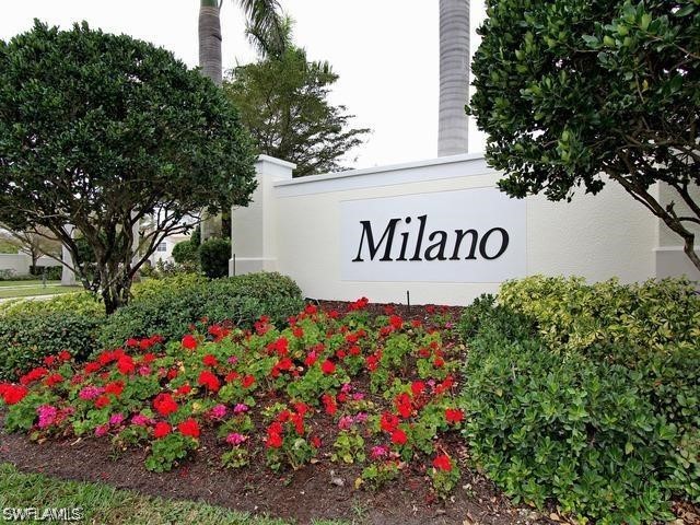 15633 Marcello Circle, Unit 133 Naples, FL 34110 - Photo 22 of 23 a sign that is in front of flowers