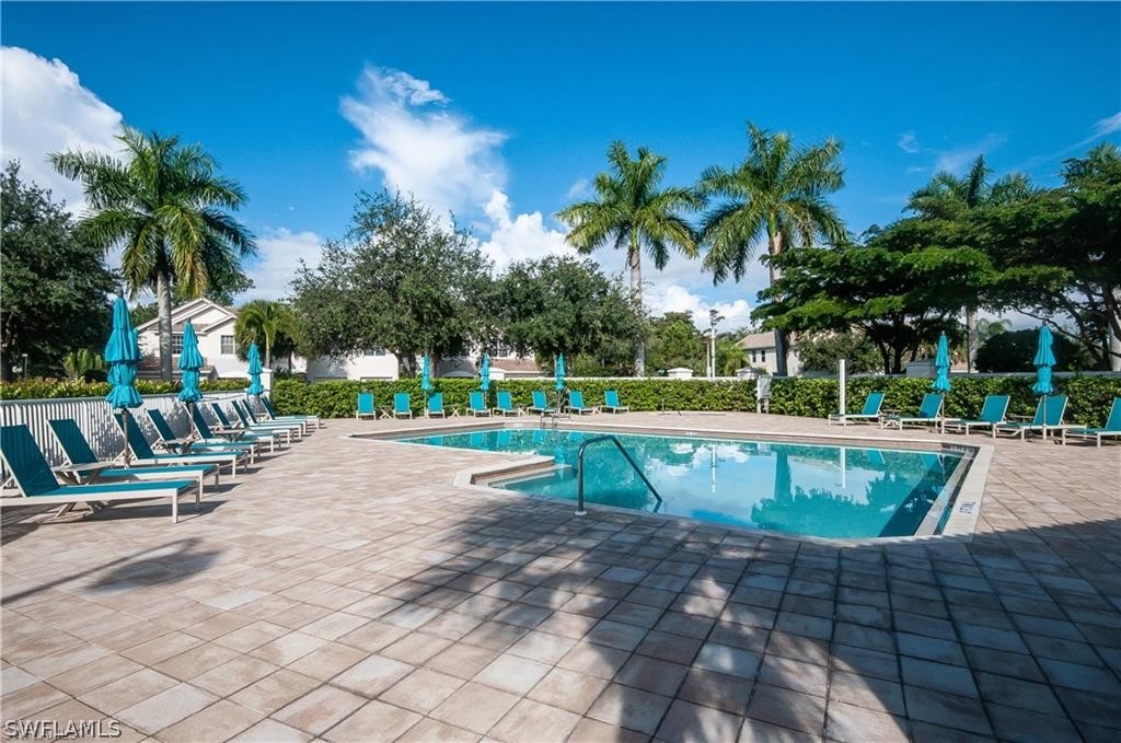15633 Marcello Circle, Unit 133 Naples, FL 34110 - Photo 23 of 23 a view of outdoor space with swimming pool