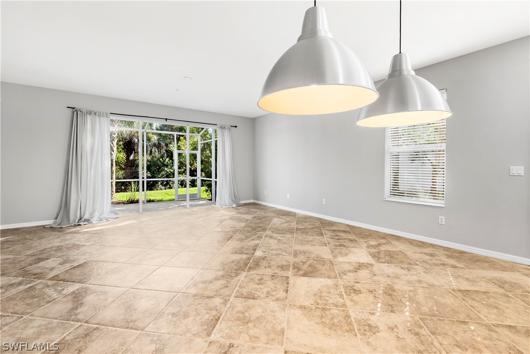 15633 Marcello Circle, Unit 133 Naples, FL 34110 - Photo 3 of 23 a view of an empty room with a window