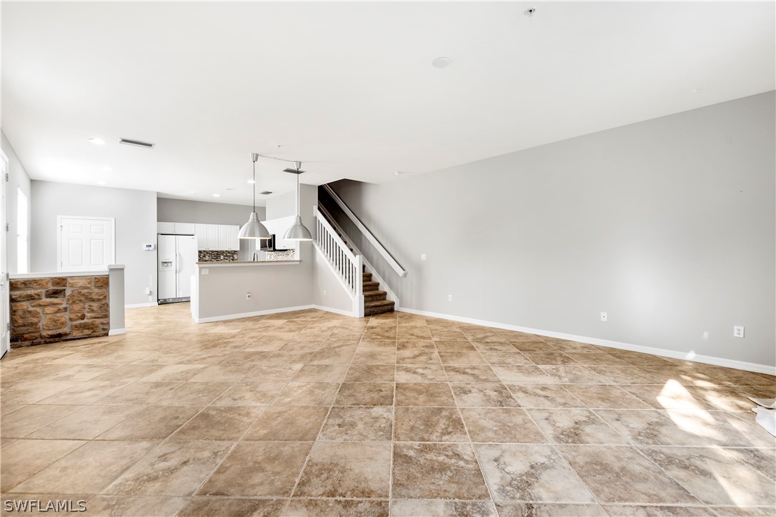 15633 Marcello Circle, Unit 133 Naples, FL 34110 - Photo 9 of 23 a view of a kitchen with a sink