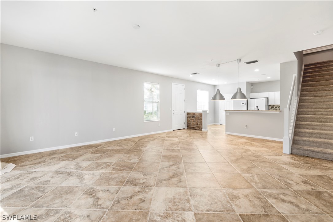 15633 Marcello Circle, Unit 133 Naples, FL 34110 - Photo 10 of 23 a view of a kitchen with a sink and cabinets