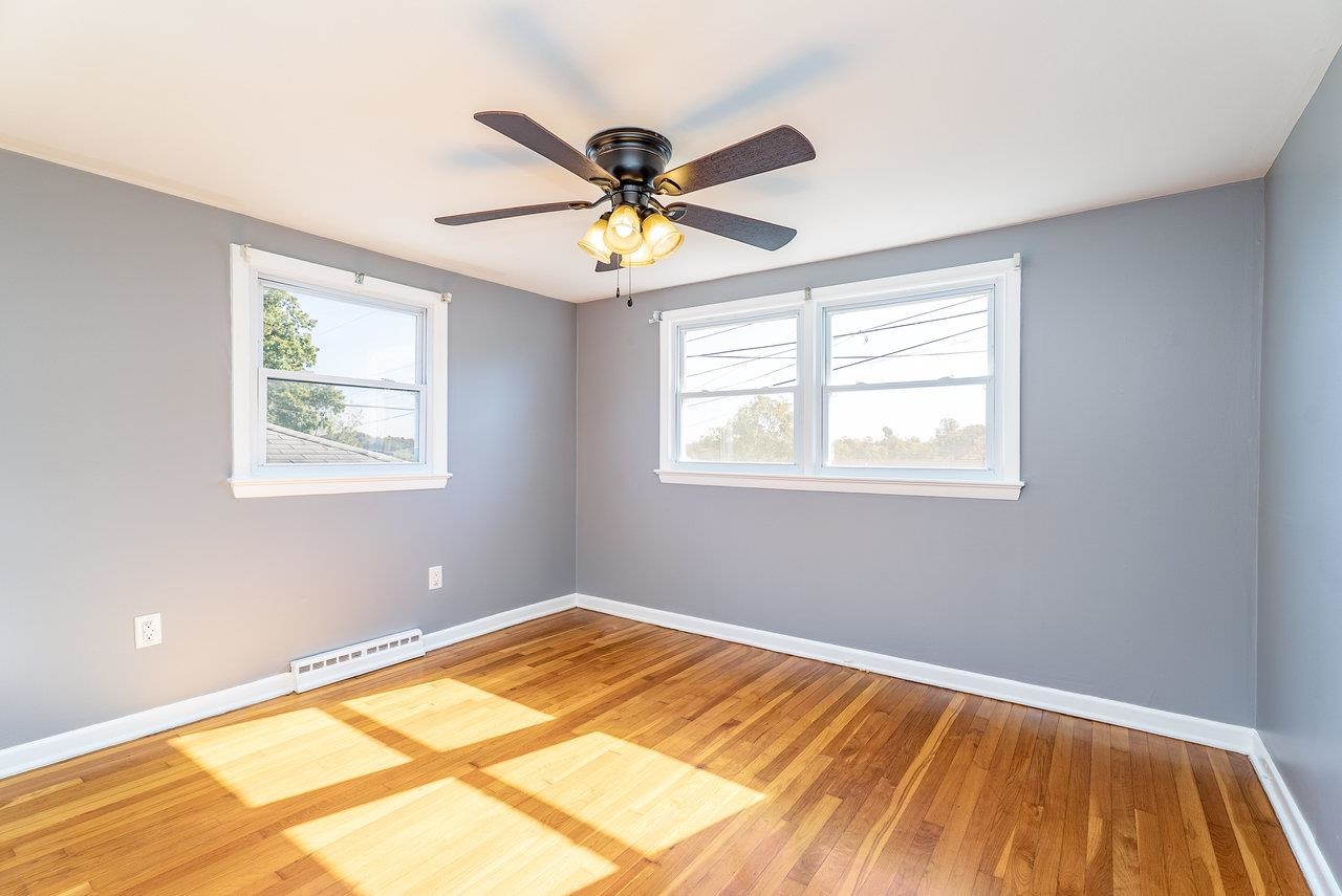 418 G Street Staunton, VA 24401 - Photo 16 of 31 a view of an empty room with window and a ceiling fan
