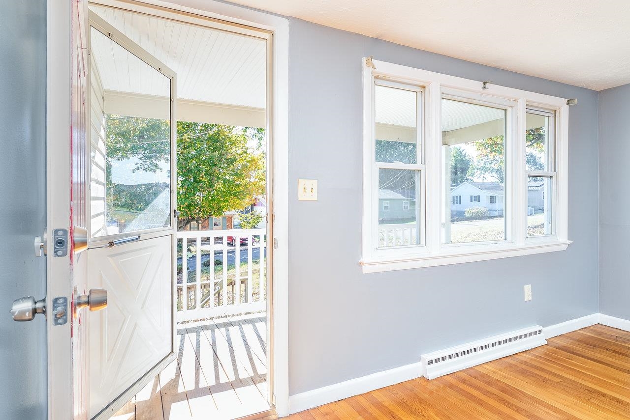 418 G Street Staunton, VA 24401 - Photo 3 of 31 a view of a bedroom with wooden floor and a window