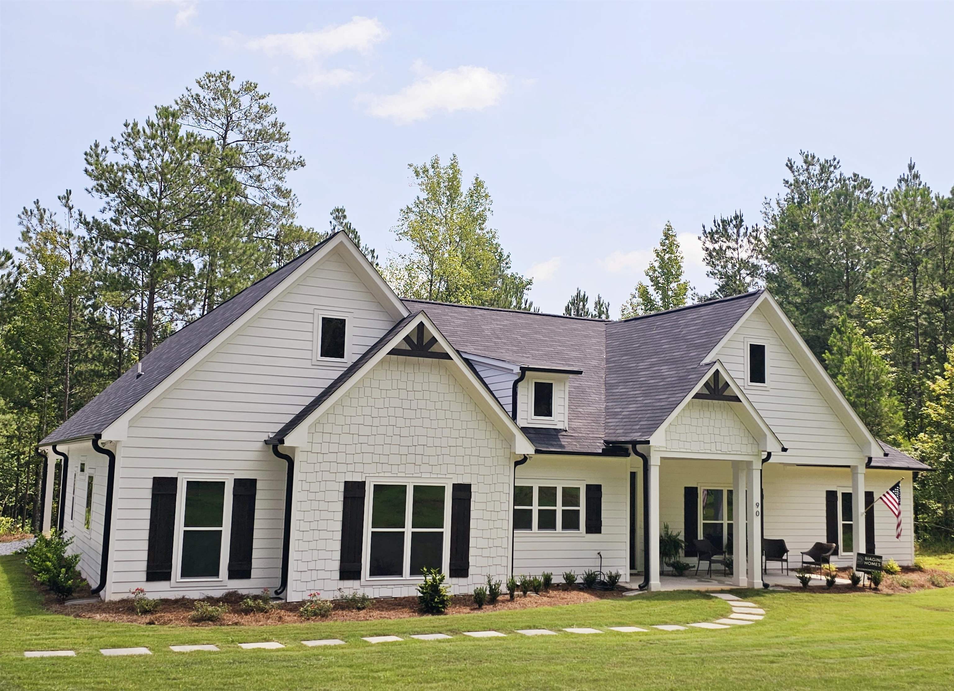 90 Joe Cook Road Franklin, GA 30217 - Photo 1 of 1 a front view of a house with a garden and trees