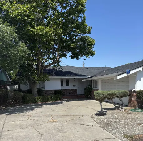 a house with trees in the background