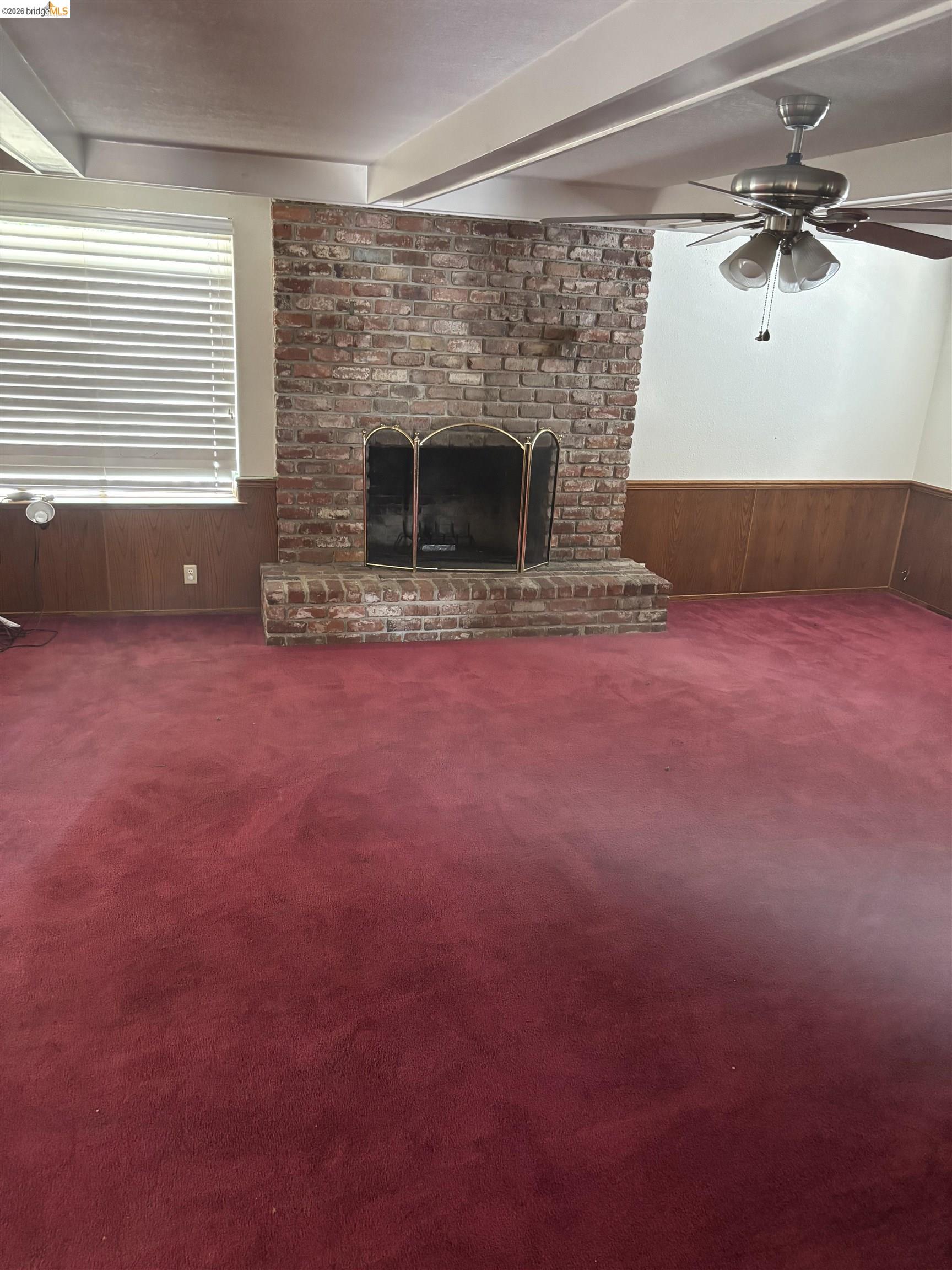 1310 B Street Antioch, CA 94509 - Photo 4 of 7 a living room with furniture and a fireplace