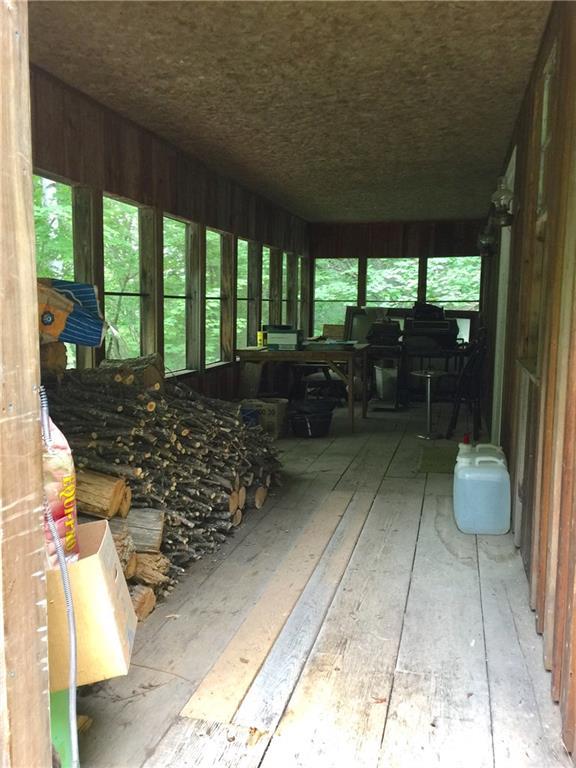 183 Weld Road Phillips, ME 04966 - Photo 13 of 21 Large glassed in porch.