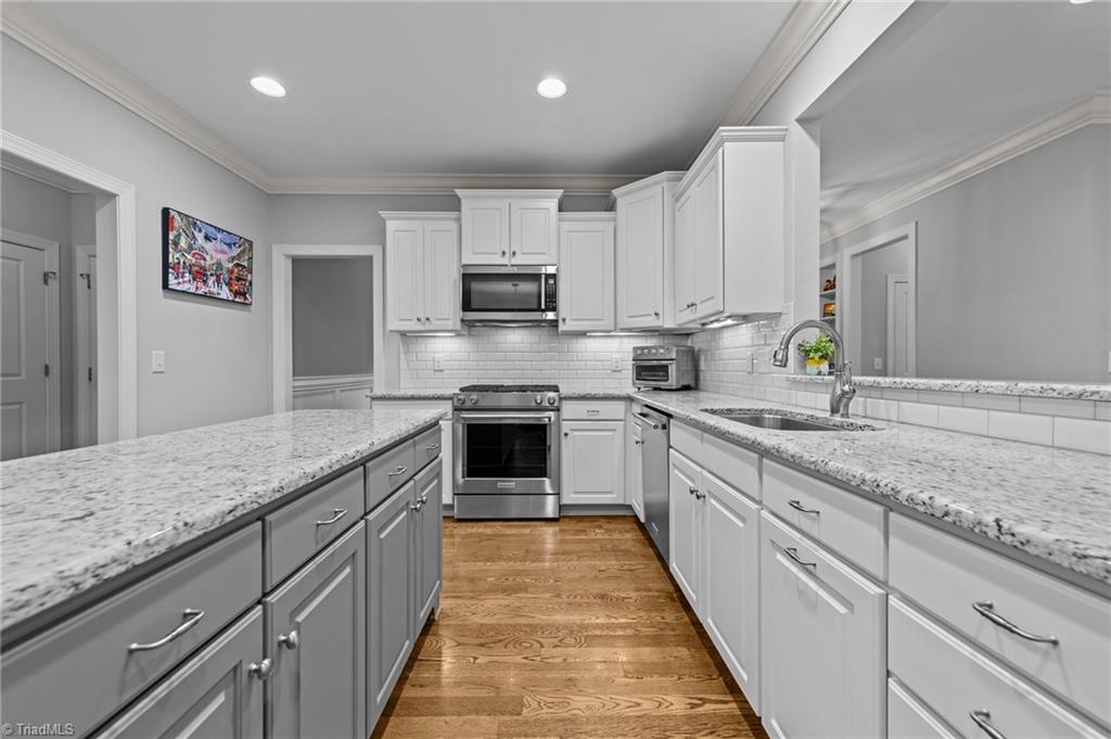 5103 Millstaff Drive Oak Ridge, NC 27310 - Photo 18 of 46 KITCHEN WITH LAREGE WORK ISLAND