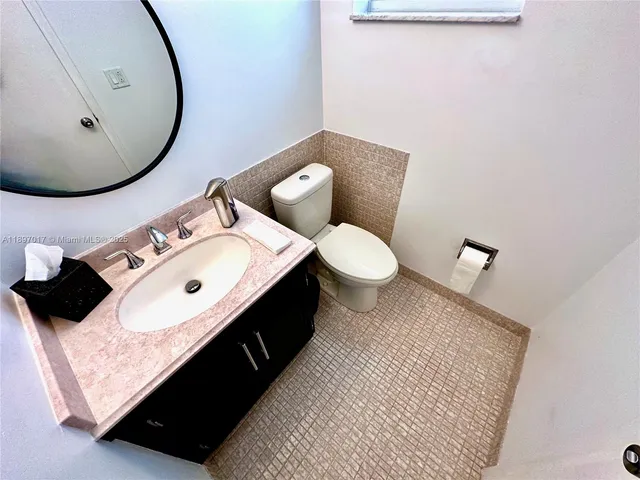 a view of a patio with furniture and backyard