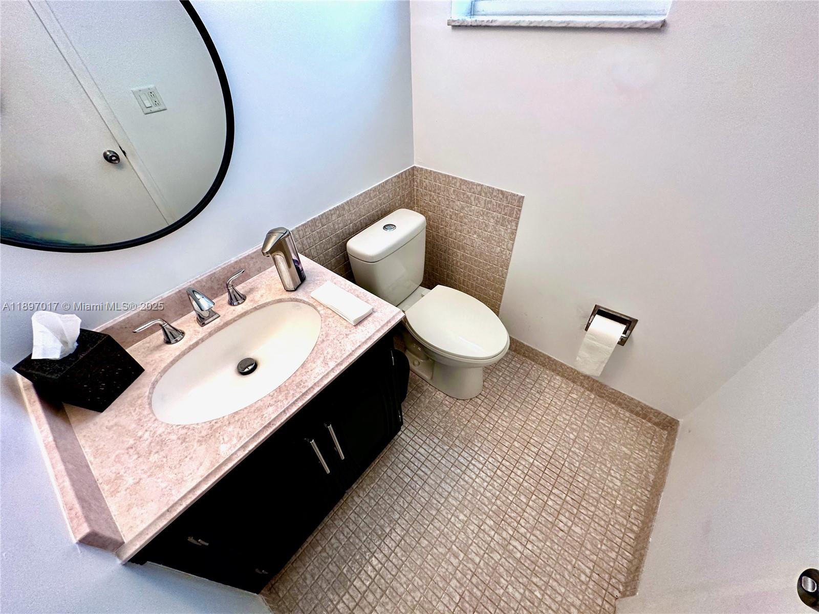 35 Colonial Club Drive, Unit 203 Boynton Beach, FL 33435 - Photo 15 of 29 a bathroom with a sink and a mirror