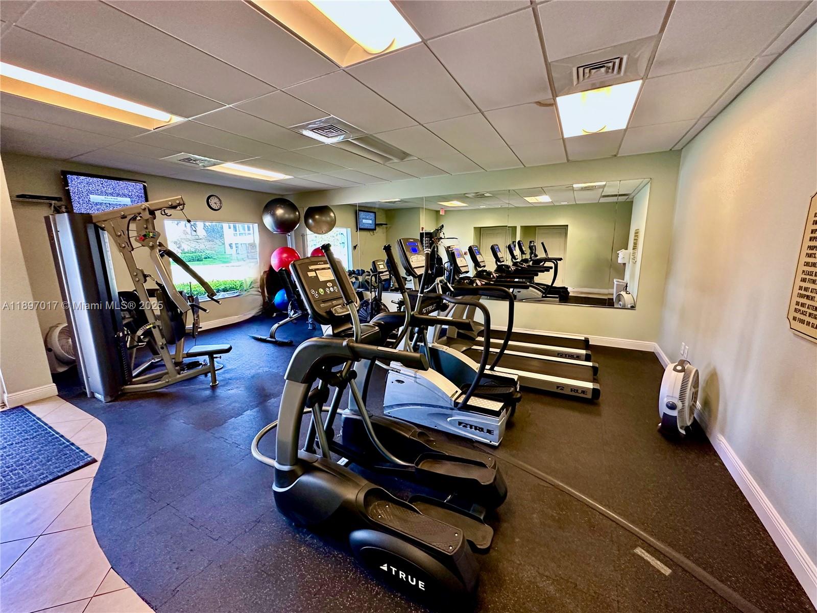 35 Colonial Club Drive, Unit 203 Boynton Beach, FL 33435 - Photo 16 of 29 a view of a room with gym equipment