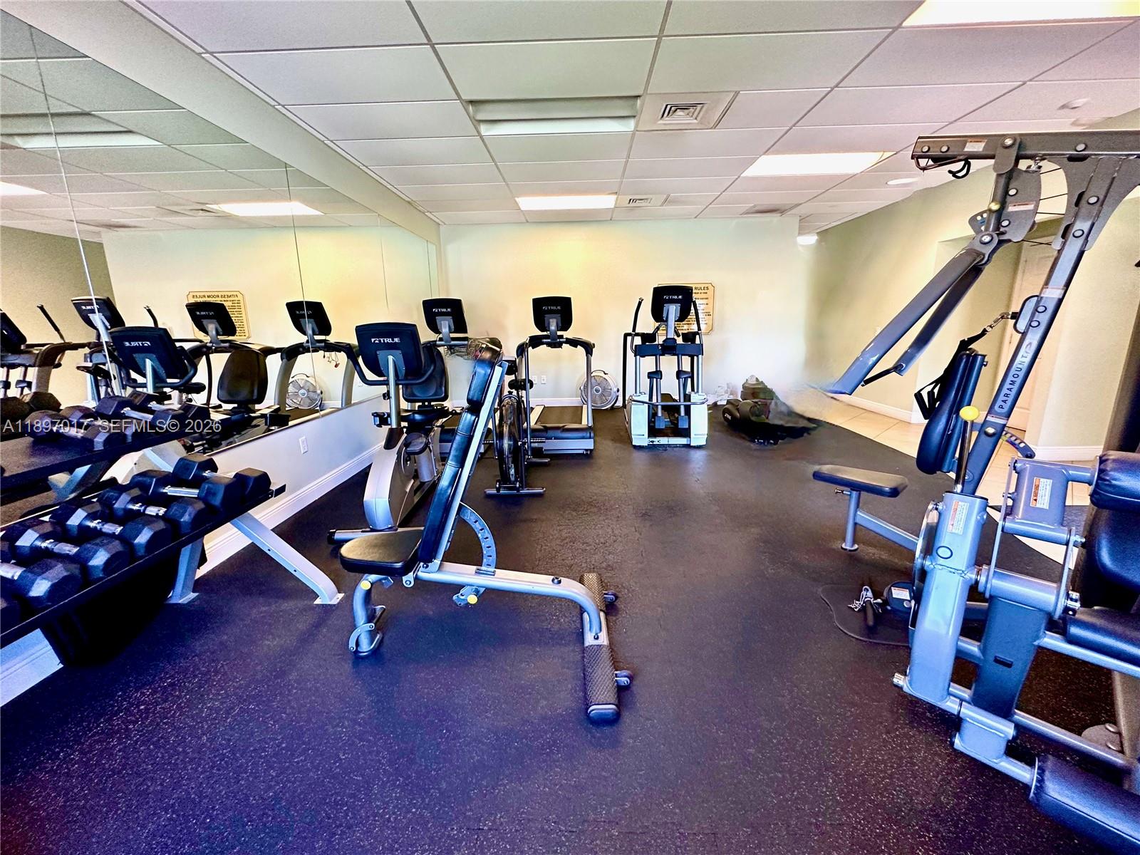 35 Colonial Club Drive, Unit 203 Boynton Beach, FL 33435 - Photo 22 of 29 a view of a room with gym equipment