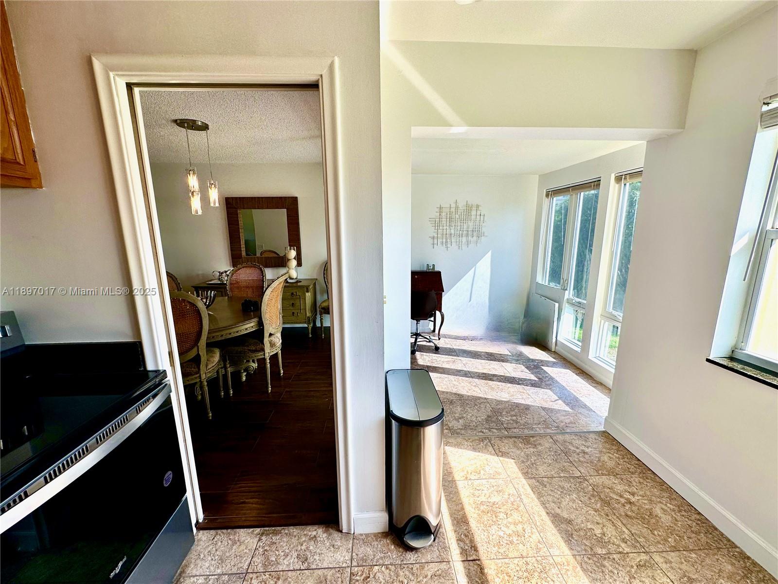 35 Colonial Club Drive, Unit 203 Boynton Beach, FL 33435 - Photo 8 of 29 a walk in closet with wooden floor and a rug