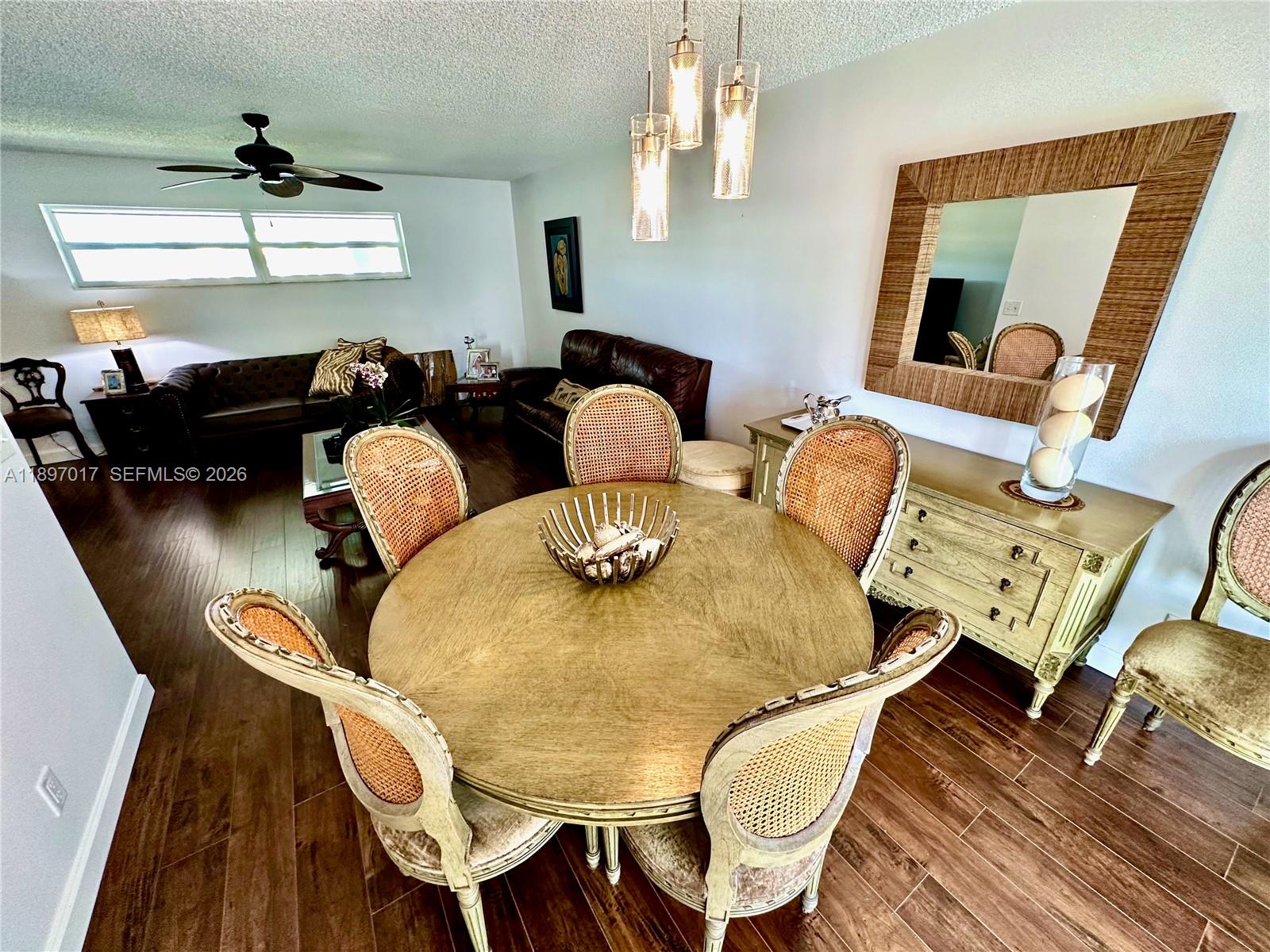 35 Colonial Club Drive, Unit 203 Boynton Beach, FL 33435 - Photo 10 of 29 a living room with furniture and wooden floor