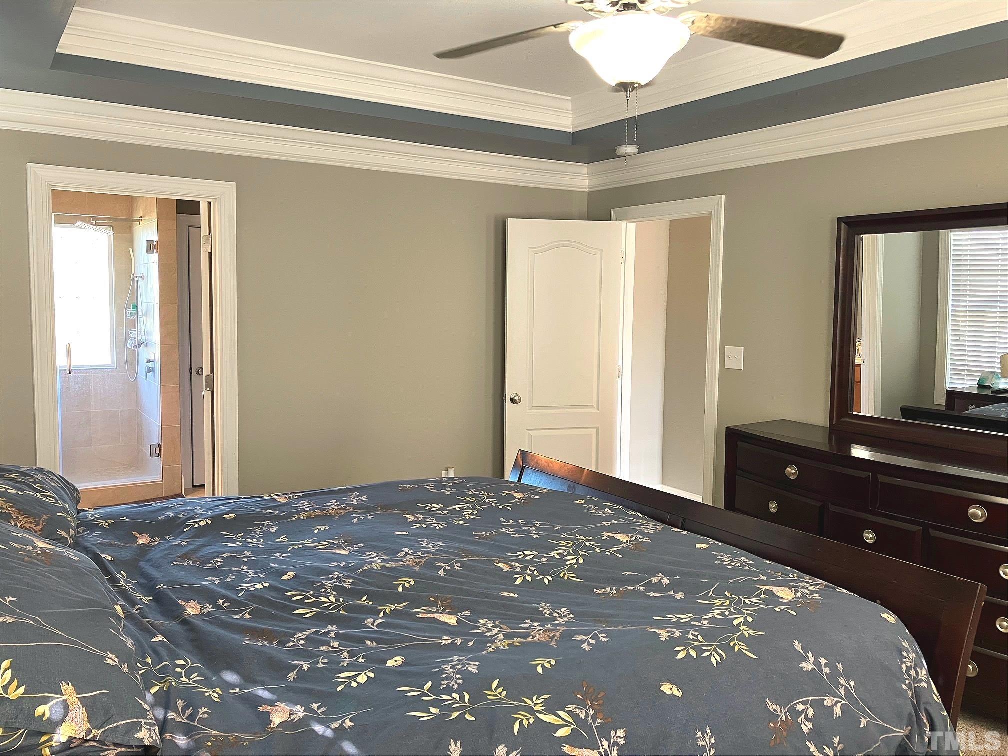 7733 Pegram Street Willow Spring, NC 27592 - Photo 18 of 34 a bedroom with a bed and a dresser