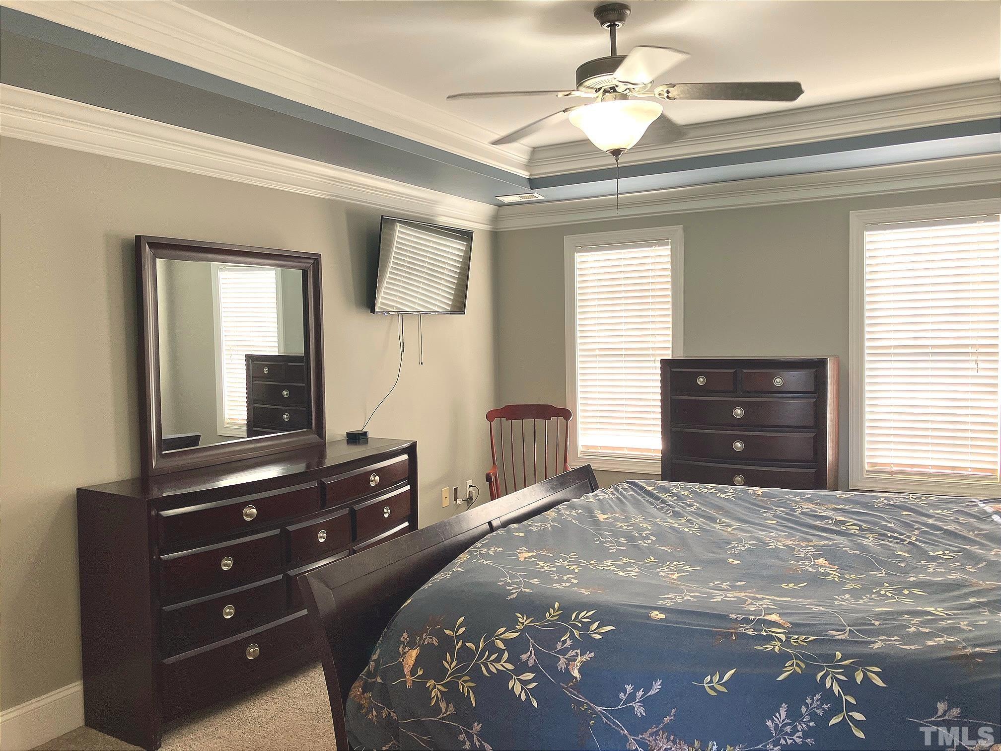 7733 Pegram Street Willow Spring, NC 27592 - Photo 19 of 34 a bedroom with a bed and a dresser
