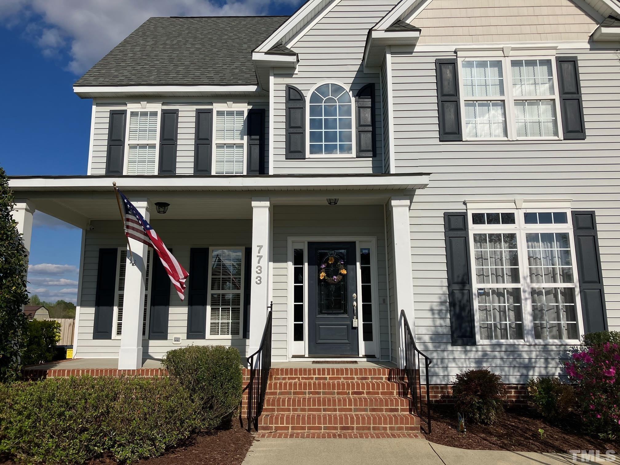 7733 Pegram Street Willow Spring, NC 27592 - Photo 2 of 34 a front view of a house with a yard