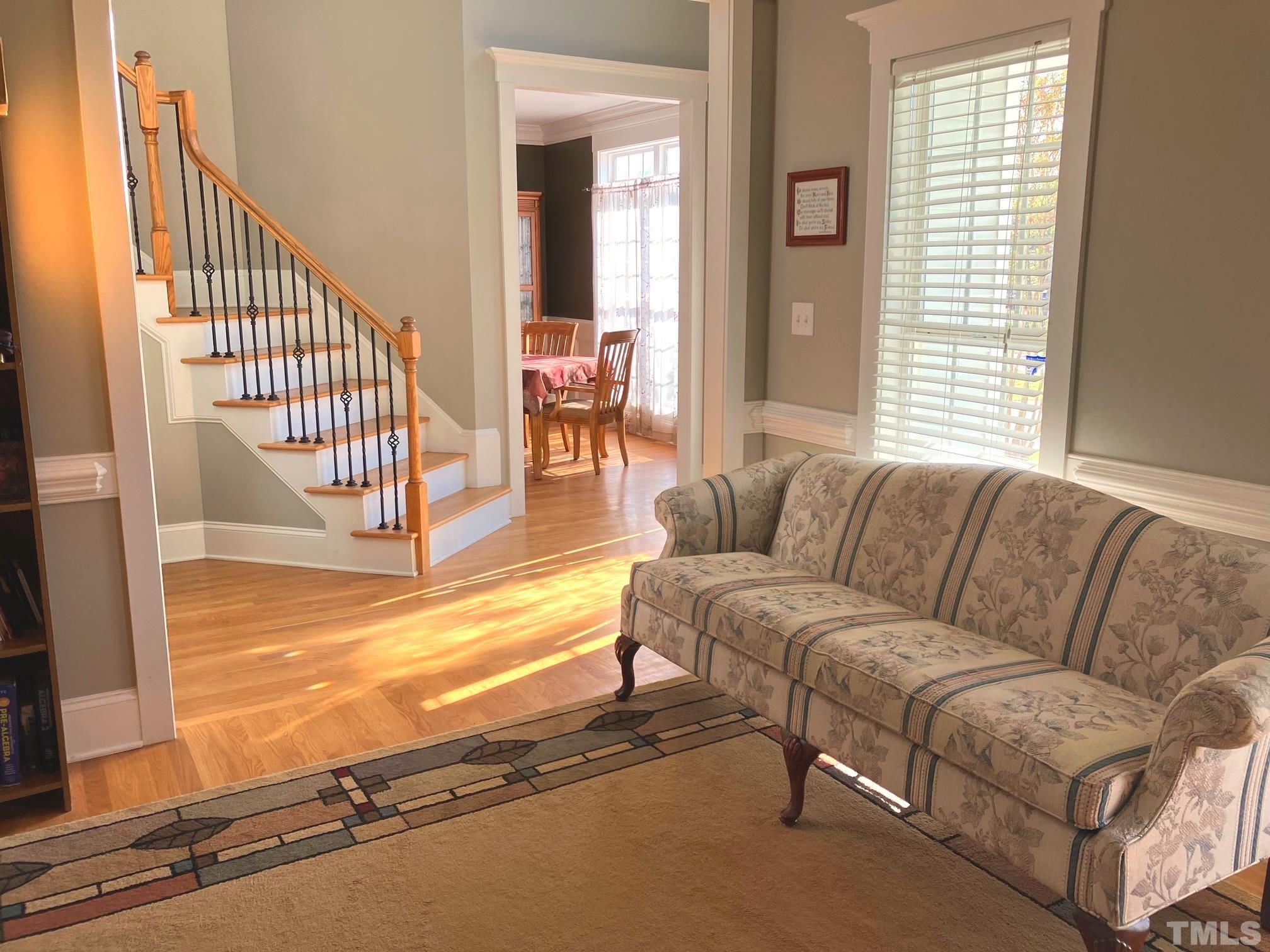 7733 Pegram Street Willow Spring, NC 27592 - Photo 5 of 34 a living room with furniture cabinets and a large window