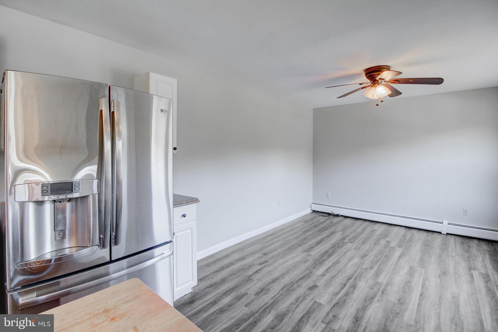 331 Juliustown Road Columbus, NJ 08022 - Photo 12 of 26 wooden floor in an empty room with a window