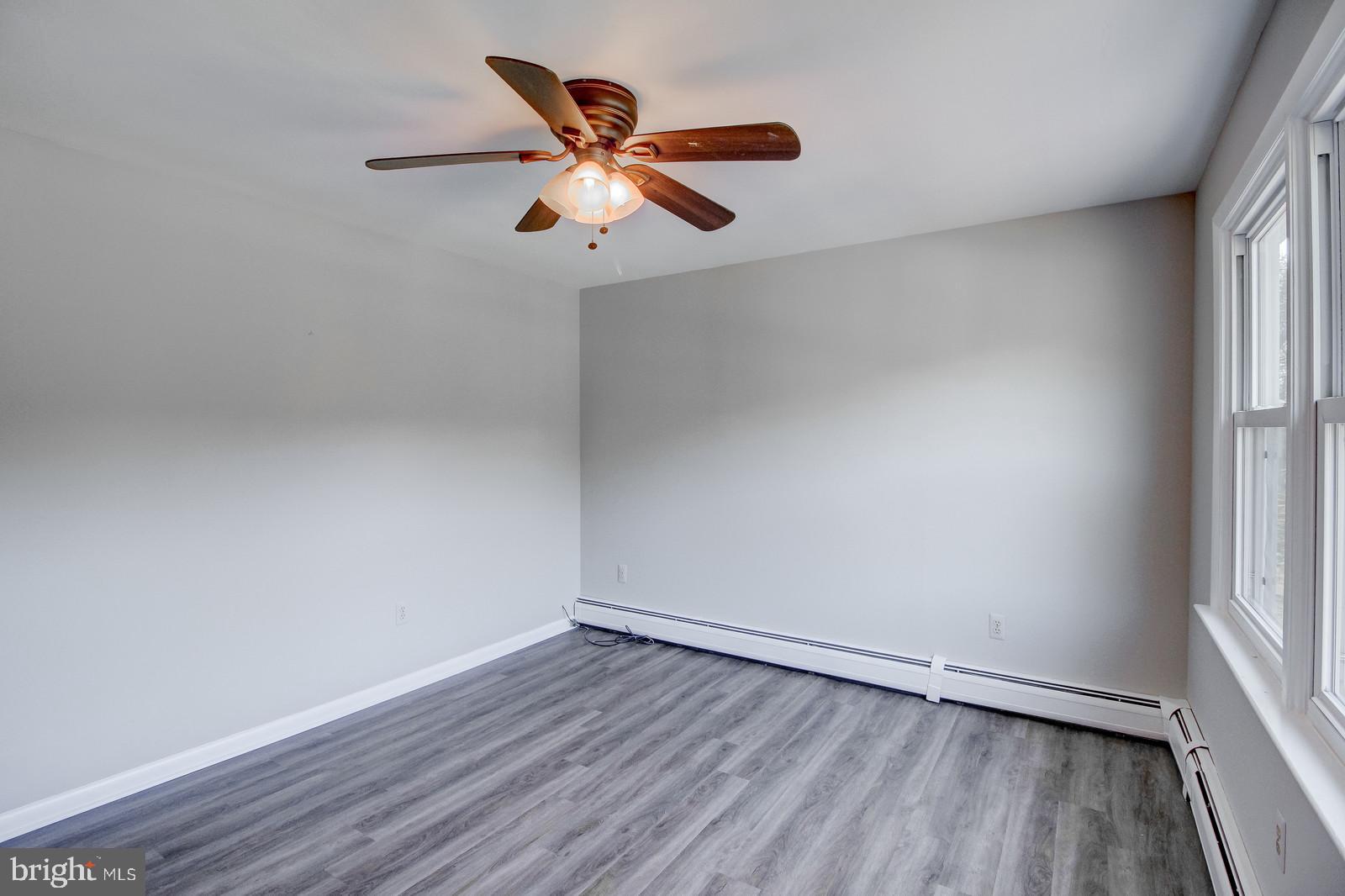 331 Juliustown Road Columbus, NJ 08022 - Photo 13 of 26 an empty room with wooden floor and windows