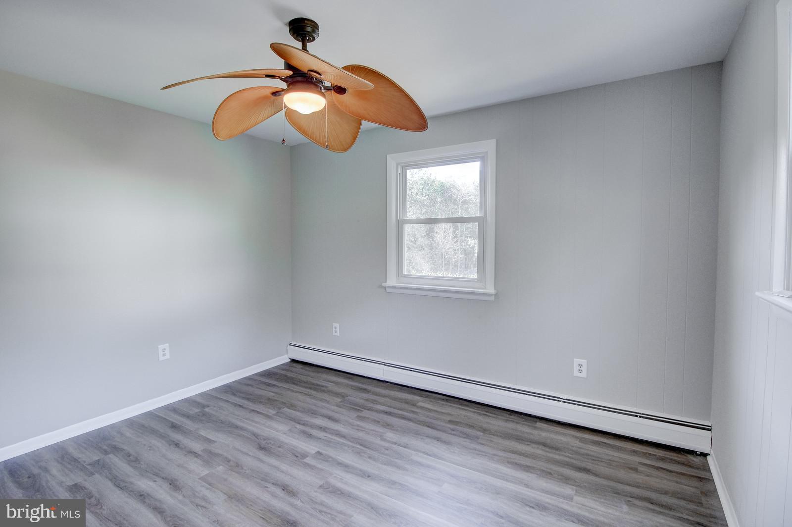331 Juliustown Road Columbus, NJ 08022 - Photo 19 of 26 wooden floor in an empty room with a window