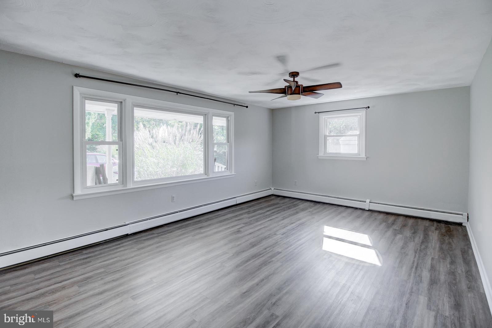 331 Juliustown Road Columbus, NJ 08022 - Photo 6 of 26 a view of an empty room with wooden floor and a window