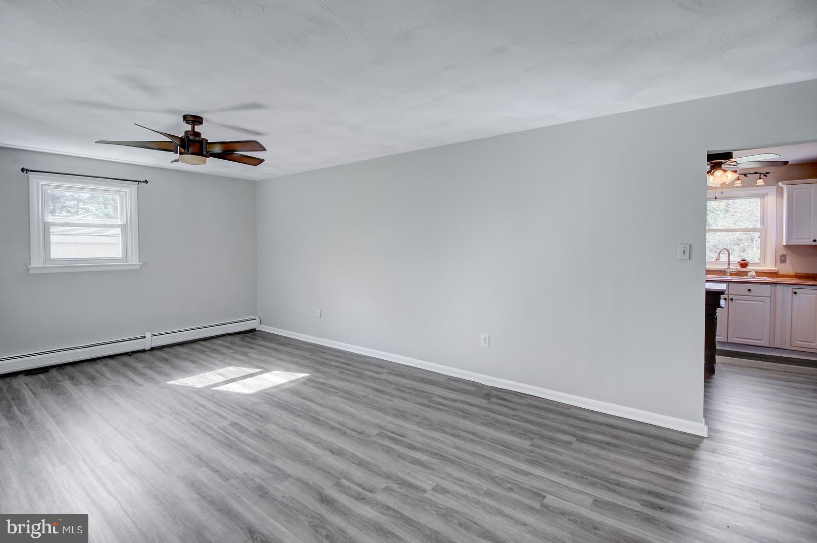 331 Juliustown Road Columbus, NJ 08022 - Photo 7 of 26 wooden floor in an empty room with a window