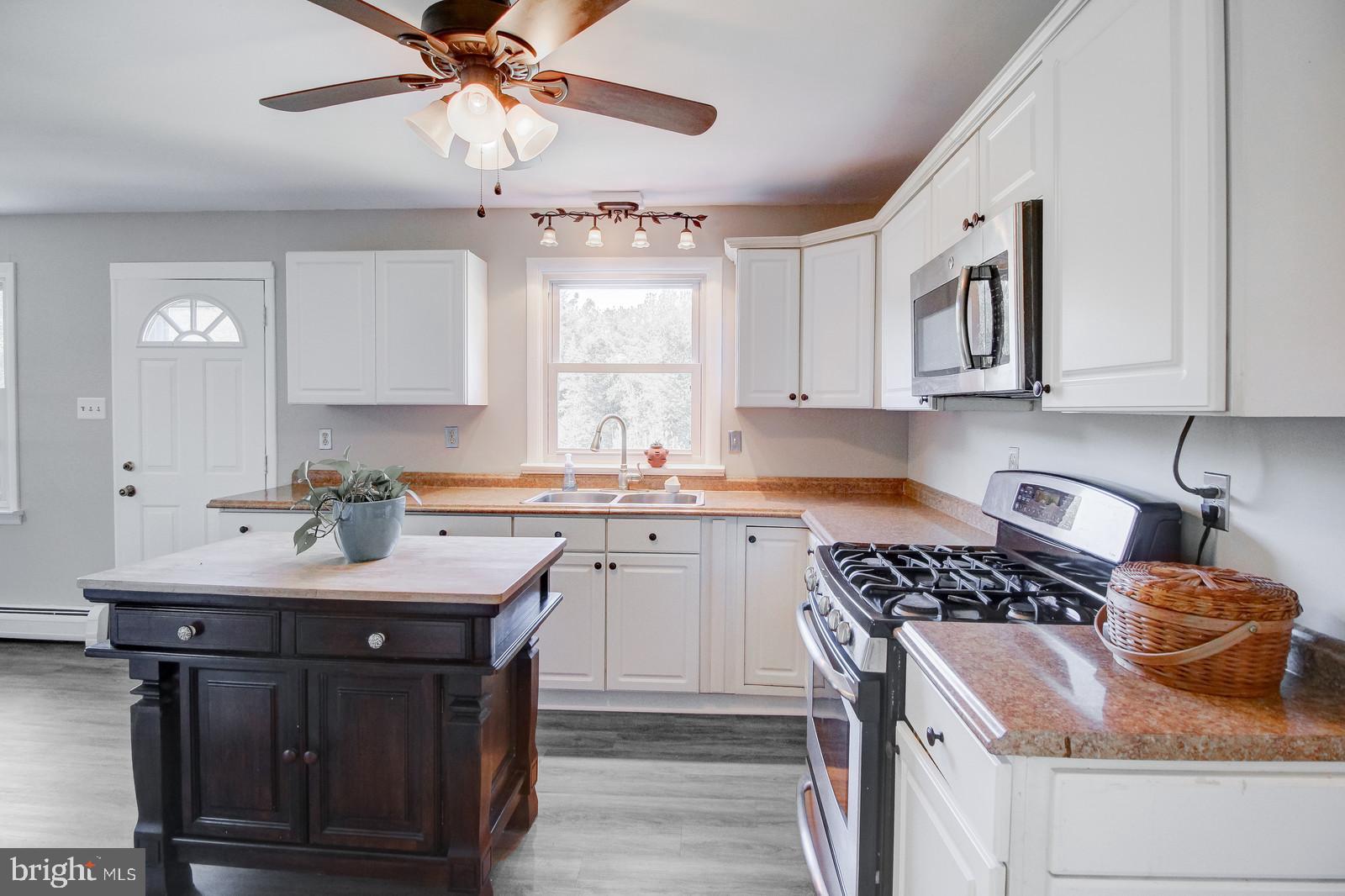 331 Juliustown Road Columbus, NJ 08022 - Photo 8 of 26 a kitchen with stainless steel appliances granite countertop a sink stove and cabinets