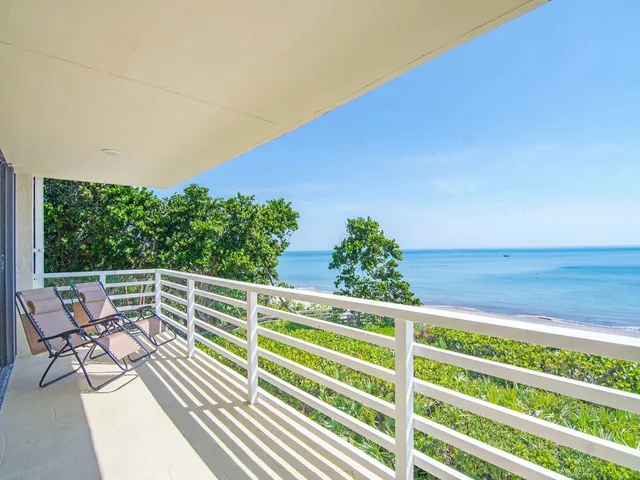 a view of balcony with furniture