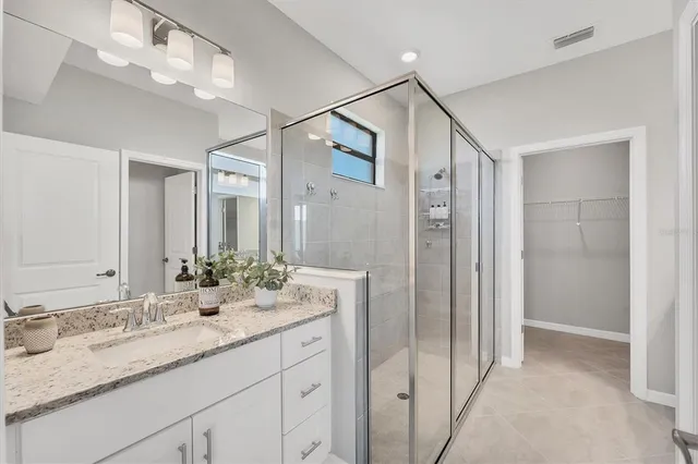 a bathroom with a double vanity sink mirror and double